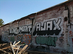 Ajax graffiti on the side of a building